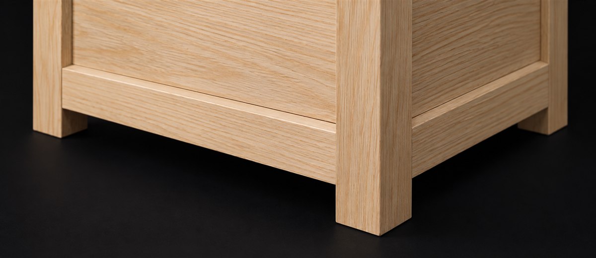 Finished frame-and-panel pine chest corner with square leg and rails